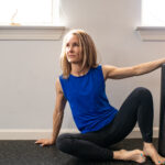 Press 2 Adrien On A Workout Mat With A Foam Roller