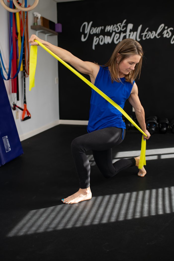 Adrien Cotton Demonstrates A Theraband Stretch 