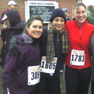 Three Women Taking A Picture After Running A Race Standing Together And Smiling At The Camera
