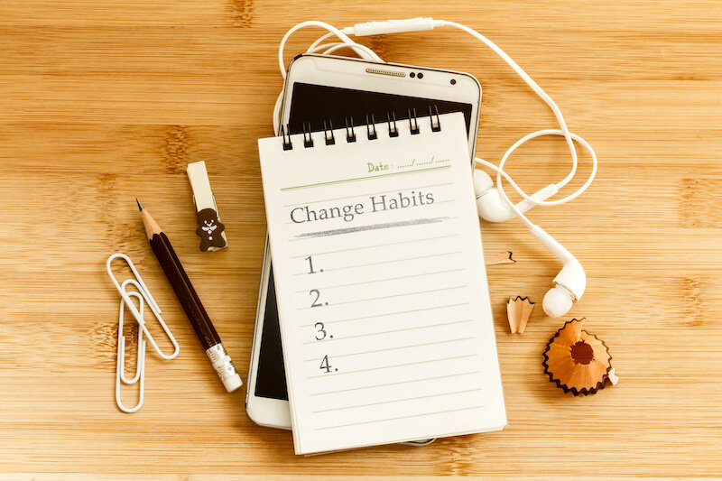 Hand Written  Change Habits Message Notepad With The  Pencil  On Wooden Table For Change Habits  List For Good Life Concept , Overhead Shot Or Top View