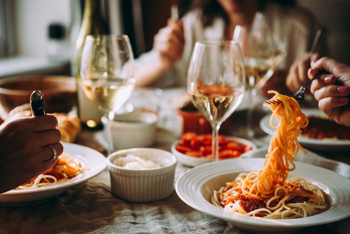 Dinner Pasta On The Table With Wine