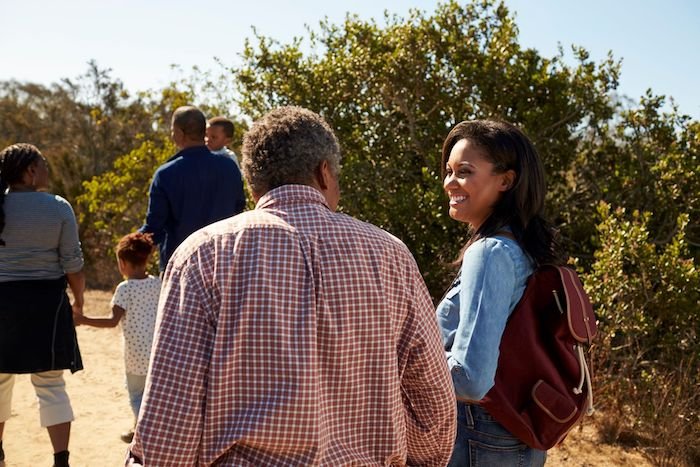 Family Walking And Talking Together 