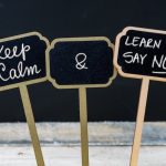 Keep Calm and Learn To Say NO message written with chalk on mini blackboard labels