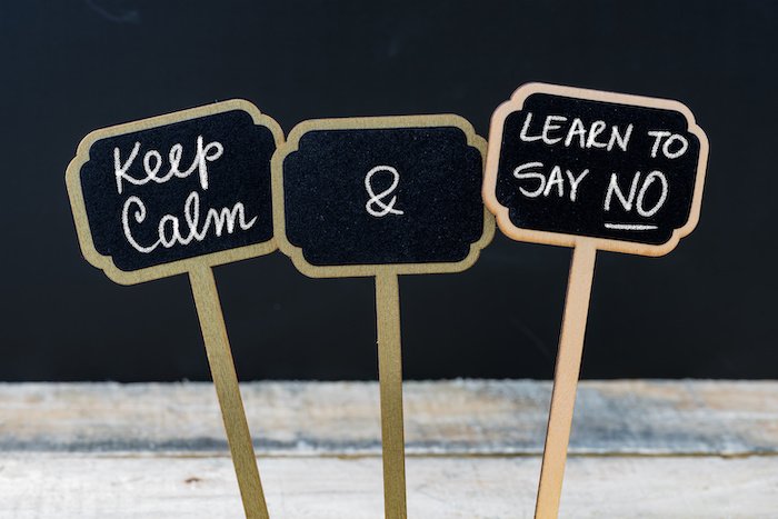Keep Calm And Learn To Say No Message Written With Chalk On Mini Blackboard Labels