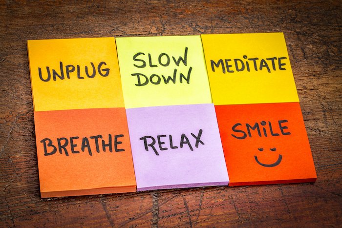 Post It Notes With Unplug, Slow Down, Meditate, Breathe, Relax, Smile  Written On Them