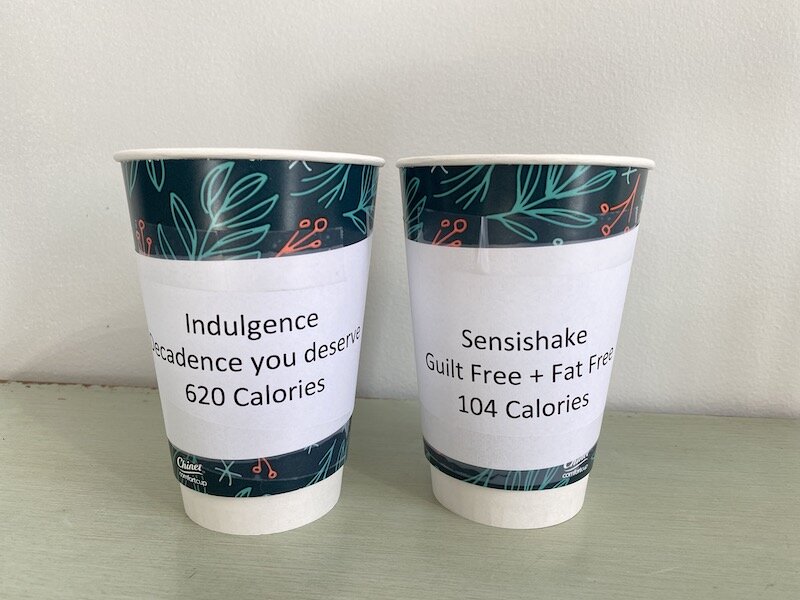 Two Cups, One Says Indulgence 600 Calories And The Other Says Sensishake 104 Calories