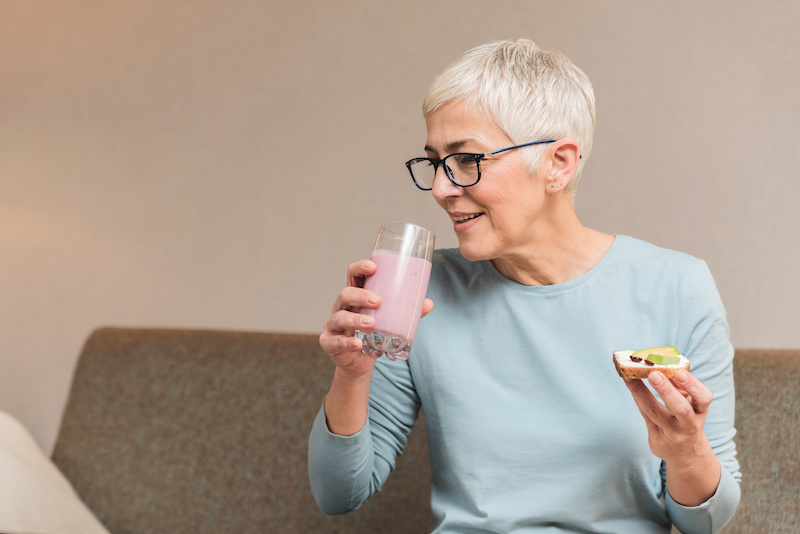 Older Woman Drinking Milkshake