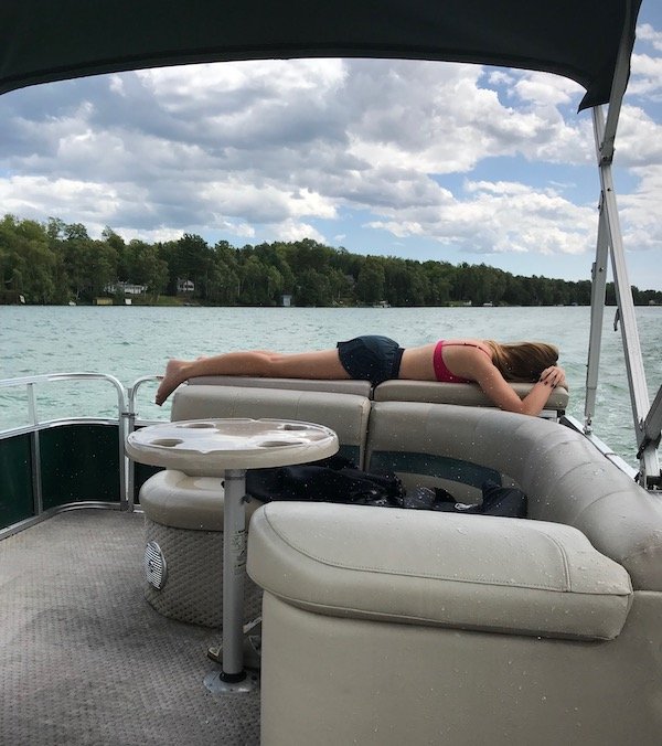 Girl Relaxing On A Boat In Upper Michigan