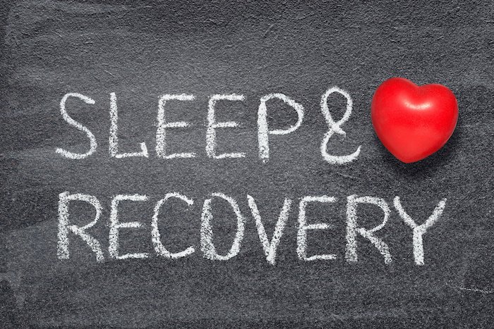 Sleep And Recovery Written On A Chalk Board With A Heart