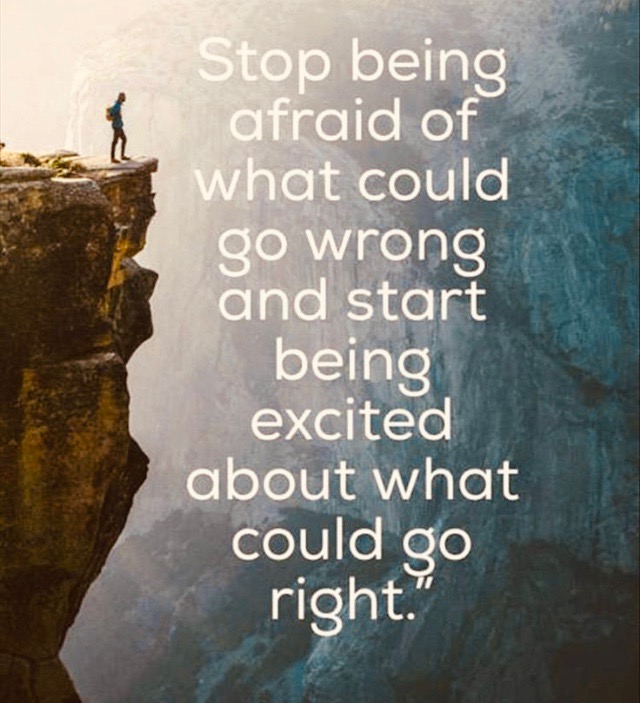 Quote &Quot;Stop Being Afraid Of What Could Go Wrong And Start Being Excited About What Could Go Right&Quot; With Photo Of Person On A Cliff. 