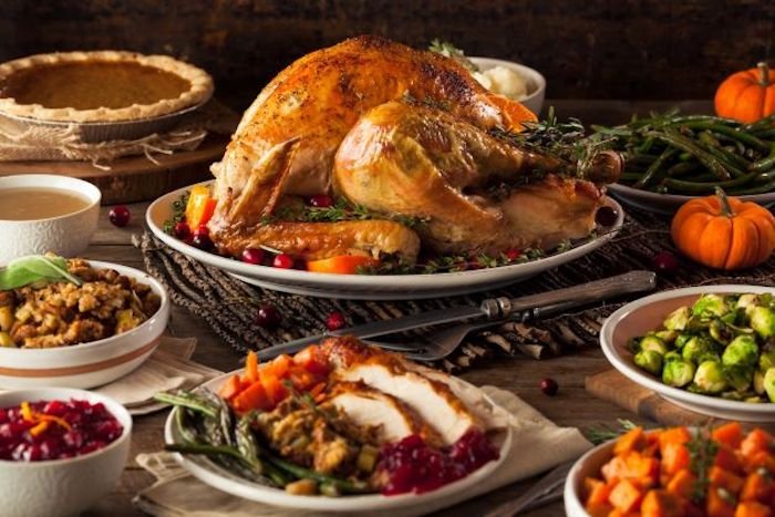 Thanksgiving Turkey On The Table Surrounded By Side Dishes