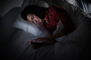 Woman In Bed Scrolling