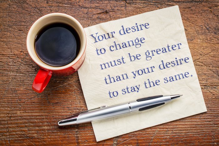 Your Desire To Change Must Be Greater Than Your Desire To Stay The Same, Quote On A Napkin With Coffee.